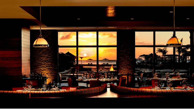 Solanio poolside restaurant at The Ritz-Carlton, Aruba offering Mediterranean-inspired casual dining near the pool in Palm Beach